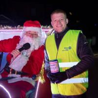 Santa, his sleigh and a Rotary helper